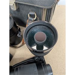 Kodak Dakon II folding camera and a collection of camera lenses and accessories, including Reflex-Nikkor  1:8 f=500mm, NikoN AF Nikkor 70-300mm 1:4-5.6G, Micro TM monocular lens and Teleshot adapter, two cases, Weston exposure meter, two cases etc