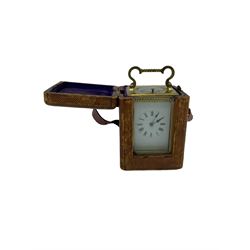 French carriage clock c1910 with strike and repeat work in a corniche case with beadwork, eight-day spring driven movement, striking the hours on a gong, with a replacement lever platform escapement, enamel dial with Roman numerals, minute track and steel spade hands, with the original velvet lined traveling box with viewing panel and key. Strike and repeat work needs attention.
