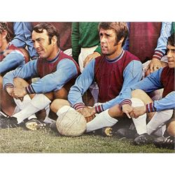 1970-1 photograph of West Ham United FC squad members, including Bobby Moore, Geoff Hurst, Harry Redknapp, Trevor Brooking, Jimmy Greaves, Billy Bonds etc, most players with signatures, 30 x 45cm, framed and glazed