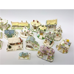 A collection of Coalport pastille burners modelled in the form of cottages and various buildings, together with models of buildings. (18). 