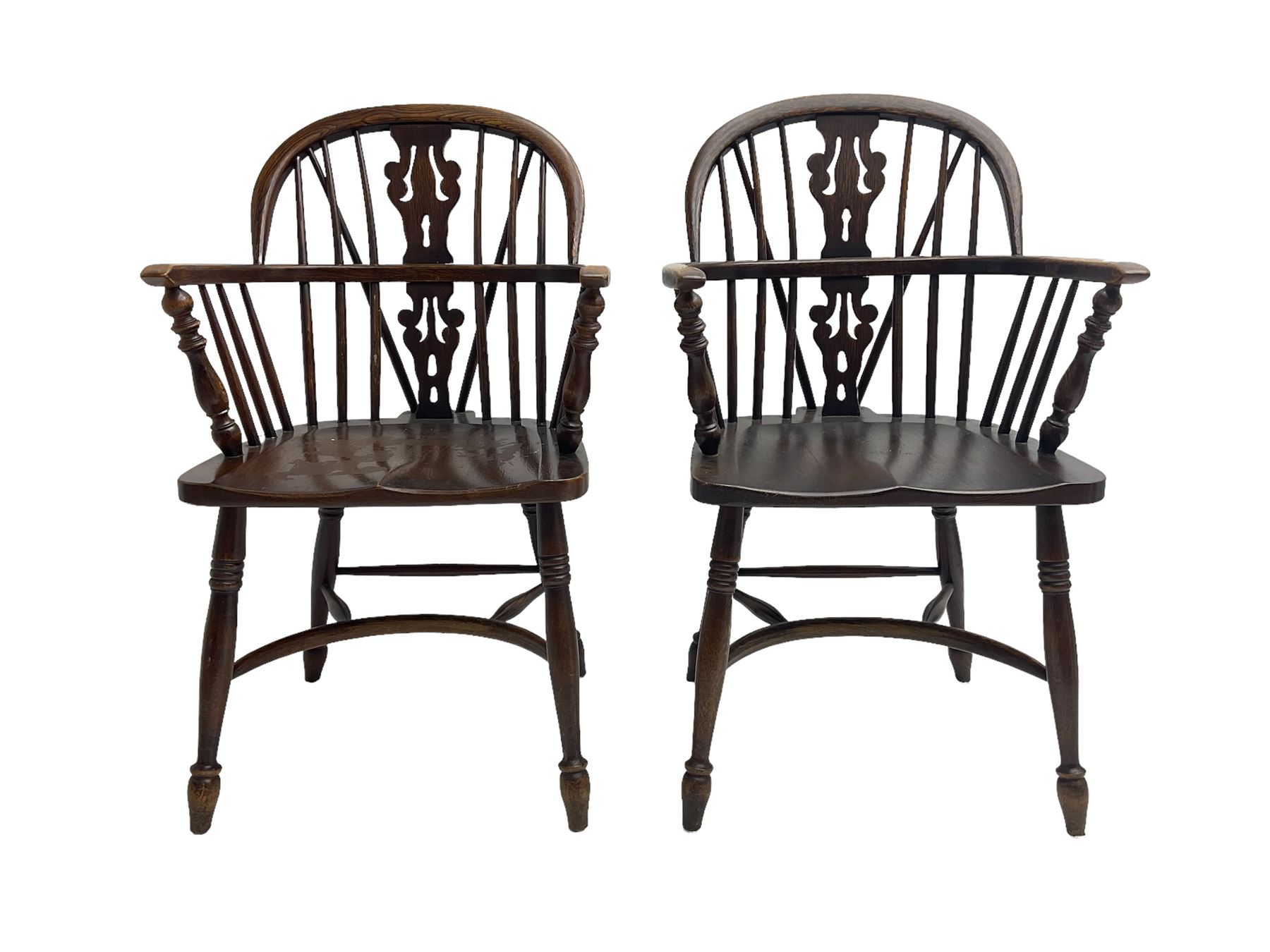 Pair late 20th century oak Windsor elbow chairs, double hoop and stick back with pierced and fretwork work splat, dished seat on turned supports joined by crinoline stretcher