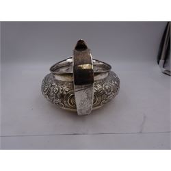 George III Irish silver teapot, of squat circular form, the body with repousse and chased floral and C scroll decoration, with capped C handle and ivory insulators, engraved to base 'Presented to Troop Sergeant Major John Percival, of the 4th Dragoon Guards by Alex D. Tait, Esq, late Captain in that corps as a mark of approbation of his steady and upright conduct when Sergeant Major of his Troop, Dublin, June 2nd 1843', hallmarked William Law, Dublin 1817, H12.5cm, This item has been registered for sale under Section 10 of the APHA Ivory Act