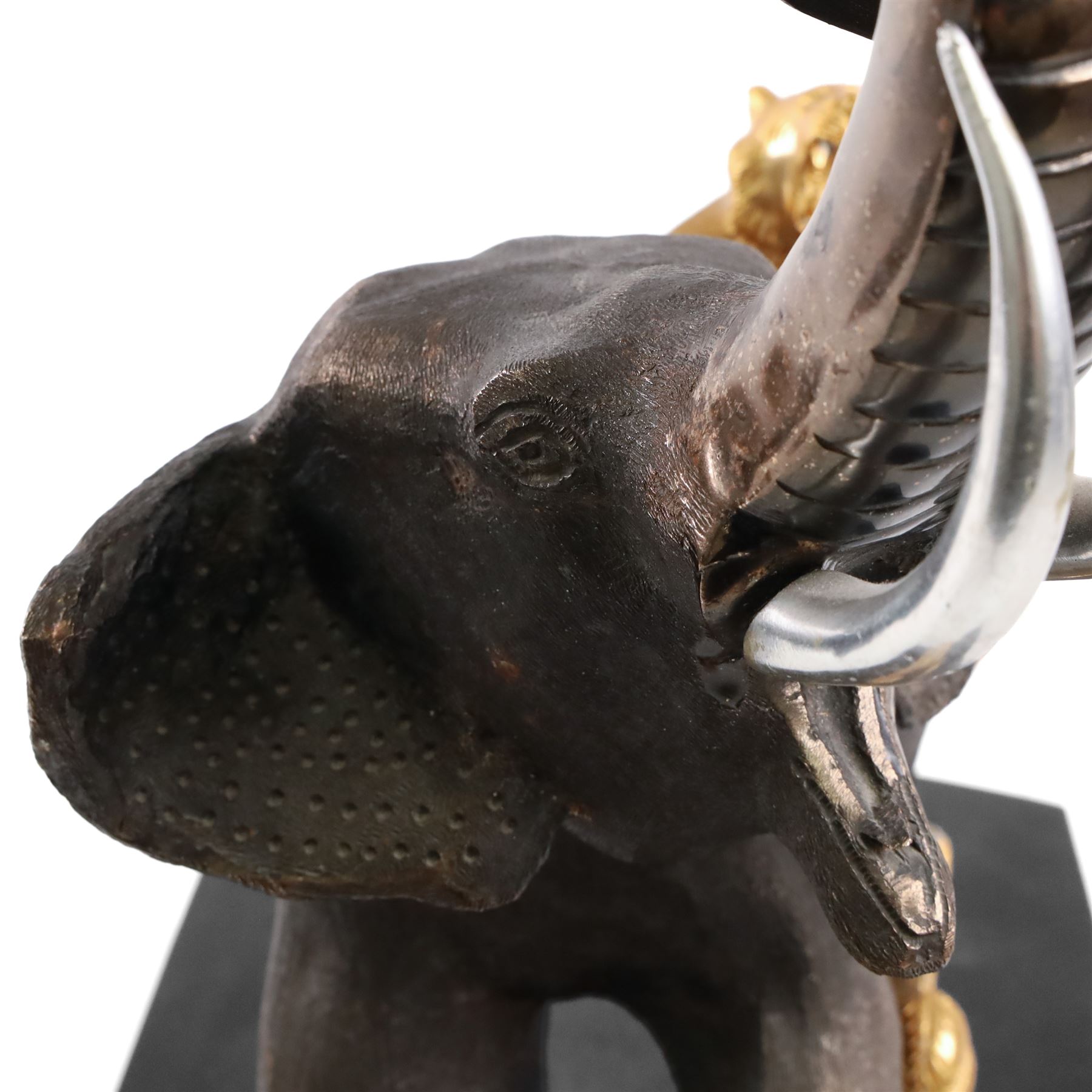 After Genryusai Seiya, modern bronzed model of an elephant being hunted by tigers, upon a black painted wooden base, height including base H45cm
