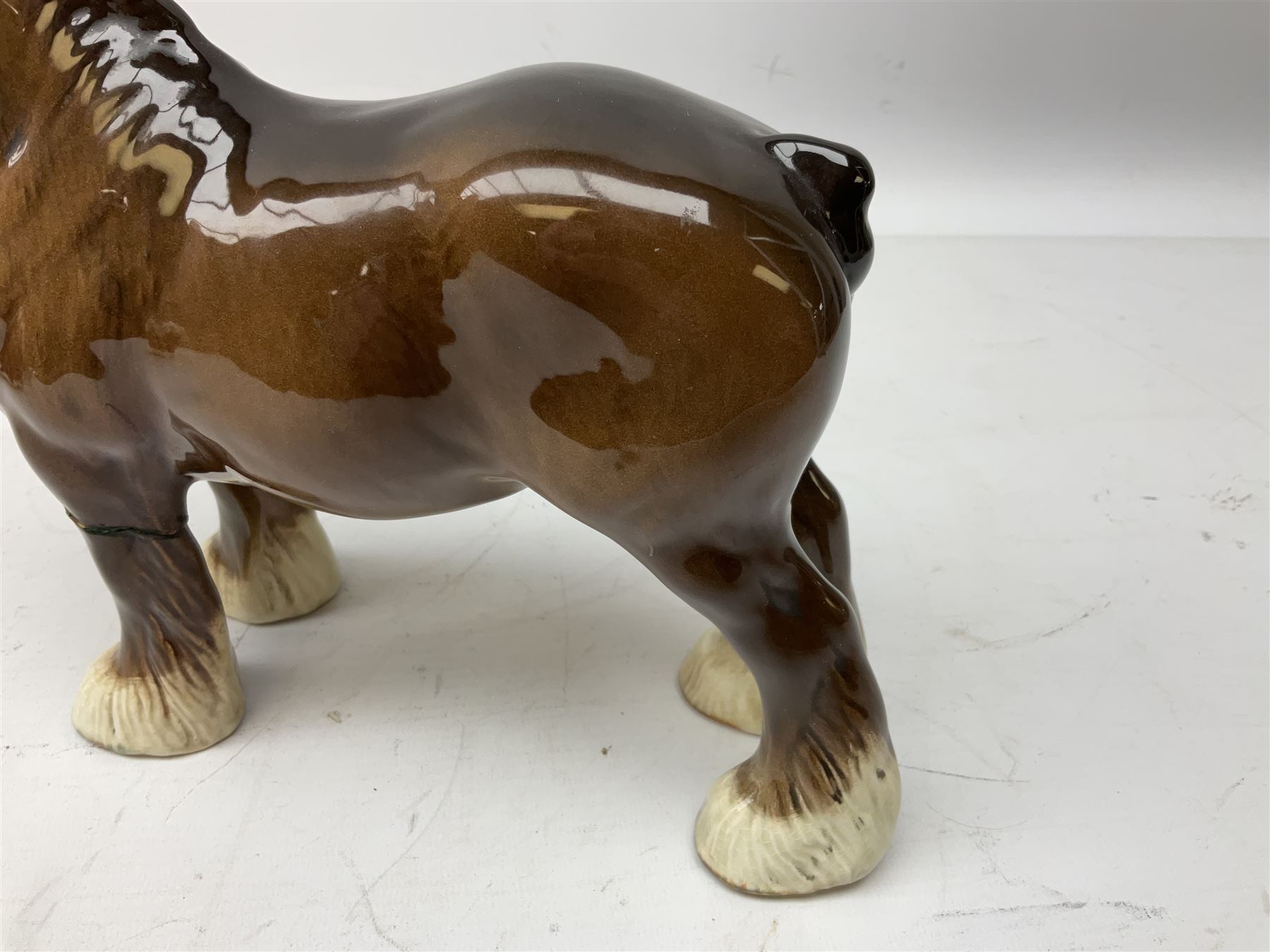 Three Beswick models comprising Hereford Bull no 949, 'CH Cutmil Cupie' Pug, and bay Shire horse, all with printed marks beneath