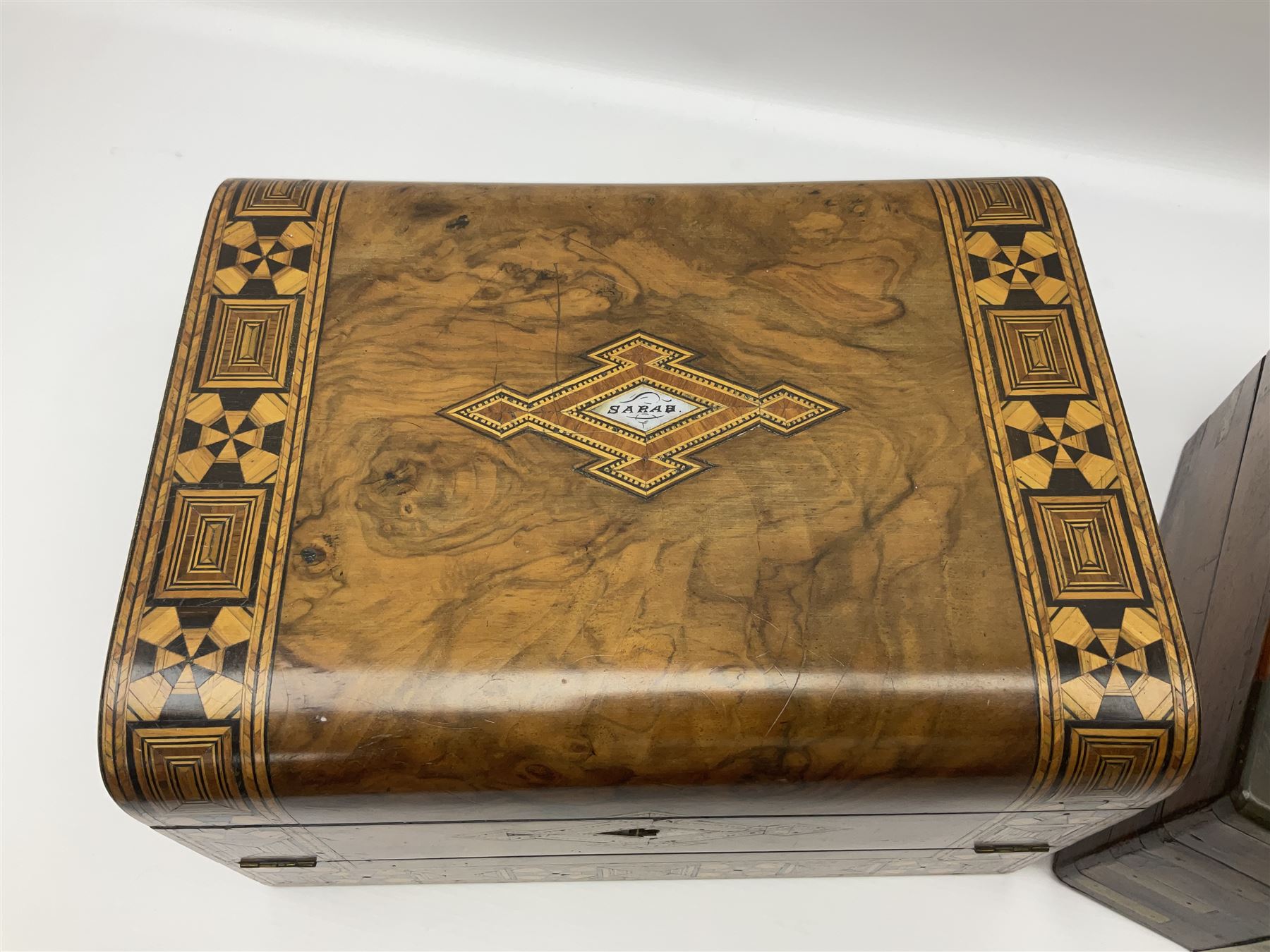 Victorian mahogany writing slope, the brass bound hinged cover opening to reveal tooled leather and gilt interior with two glass inkwells, together with a similar parquetry inlaid writing slope, with central mother of pearl inlay enrgraved 'Sarah', tallest H17cm 