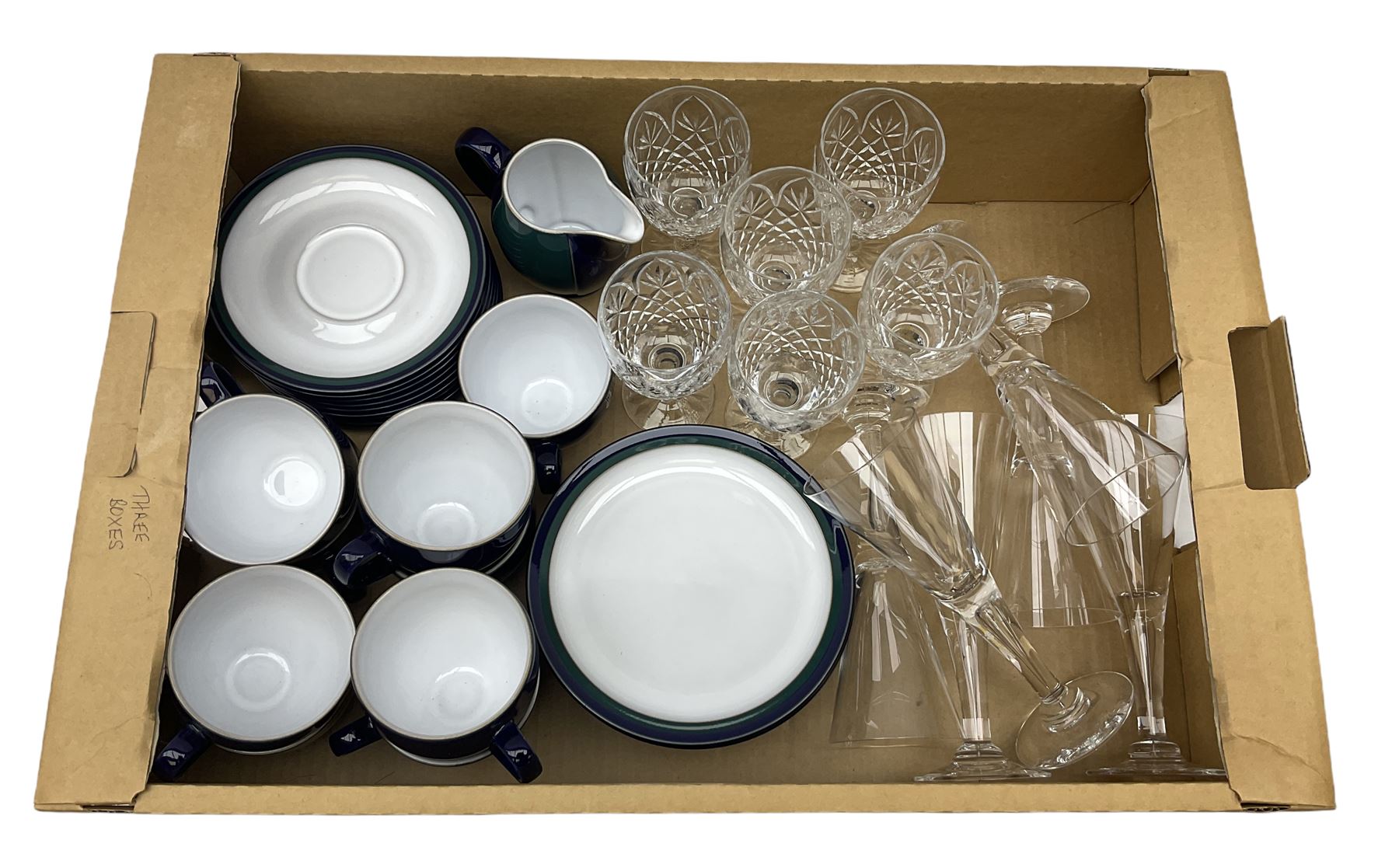 set of six Dartington champagne glasses, with an internal elongated tear in the stem, together with a set of six wine glasses and Denby regatta pattern tea wares comprising of milk jug, eight dessert plates, nine tea cups and eight saucers 