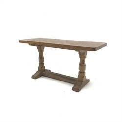 'Mouseman' adzed Yorkshire oak coffee table, rectangular top raised on octagonal supports with sledge feet, united by floor stretcher, by Robert Thompson of Kilburn, 91cm x 38cm, H45cm