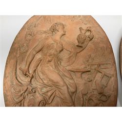 Pair of 19th century classical terracotta relief wall plaques depicting the goddess Hygeia and another goddess, seated holding an ewer, each of oval form, indistinctly signed, each stamped Ferreira verso, H42cm, W30cm