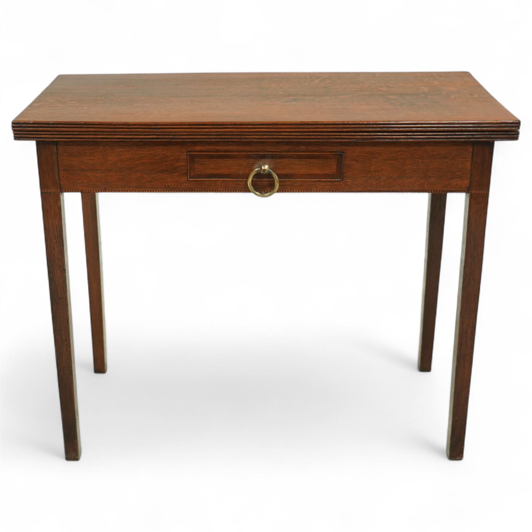 Early 20th century oak side table, rectangular top over single frieze drawer with brass ring handle, raised on square tapering supports