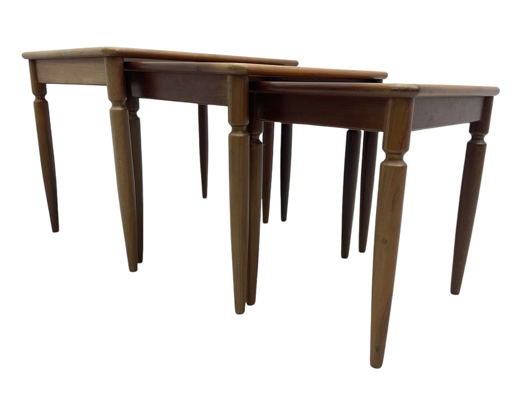 G-Plan - teak nest of three tables, rectangular top raised on turned supports