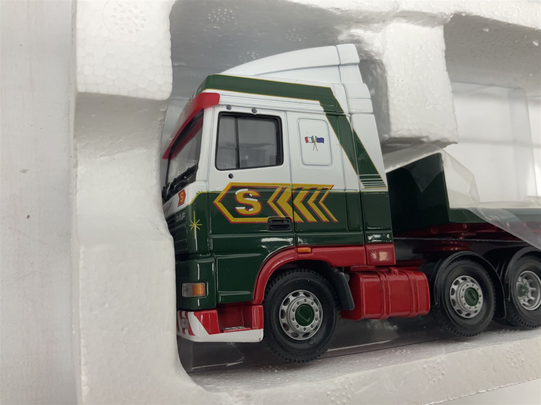 Corgi Eddie Stobart - three limited edition lorries; CC12901 Scania Topline Curtainside; CC13101 Volvo F88 Box Trailer; and CC13207 DAF XF Space Cab & Flatbed Trailer; all boxed (3)