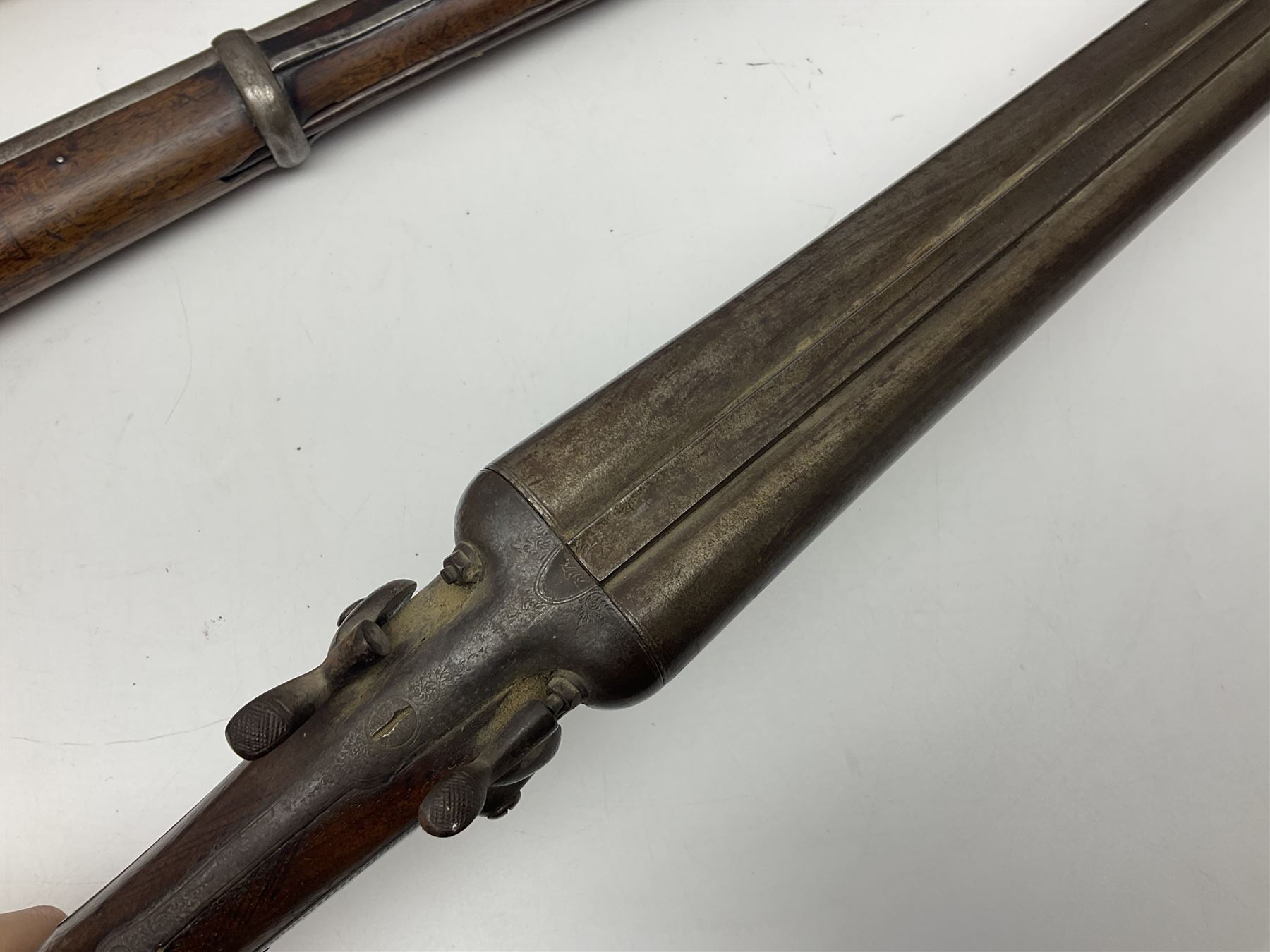 19th century Indian .577 Enfield muzzle loading rifle, proofed for 26-bore, the 98.5cm barrel with three barrel bands and later ram rod L140cm overall; 19th century Belgian side-by-side double barrel percussion shotgun, approximately 20-bore, with 74cm barrels and studded walnut stock, lock plate marked 'Liege 1868' and 'V. Gulikers-Maquinay' L117cm overall; and another side-by-side double barrel shotgun by Smythe with underlever opening (3)