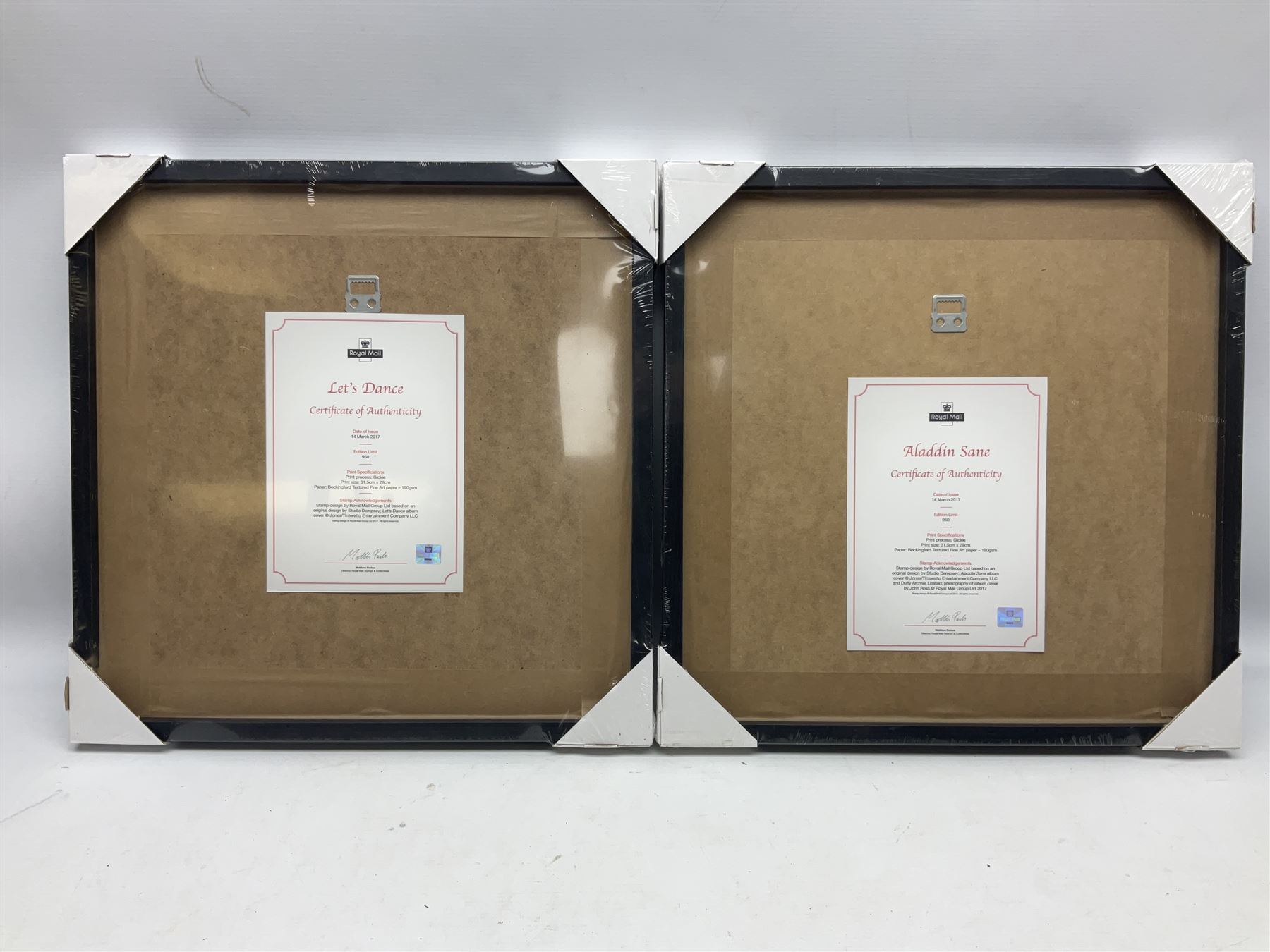 Set of four Royal Mail David Bowie limited edition album stamp prints, comprising Blackstar, Heroes, Let's Dance and Aladdin Sane, all framed and in original packaging, H43cm W43cm