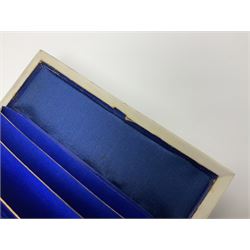 Victorian mother of pearl tea caddy, of rectangular bow-fronted form, the body with floral, bird and geometric engraved mother of pearl panels, white metal shield plaque to the cover inscribed with the initials G.J.A and similar escutcheon, the two division interior with ivory edging and two panelled mother of pearl lids, on four vegetable ivory bun feet L20cm, together with a similar style mother of pearl card case (2) This item has been registered for sale under Section 10 of the APHA Ivory Act