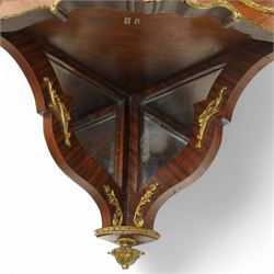 Pair of late 19th to early 20th century Kingwood and ormolu mounted encoignure or wall hanging corner cabinets, shaped end supports with mirror backs, serpentine double cupboard mounted by sevres design porcelain panels, decorated with foliate cast metal mounts, the interior fitted with shelf