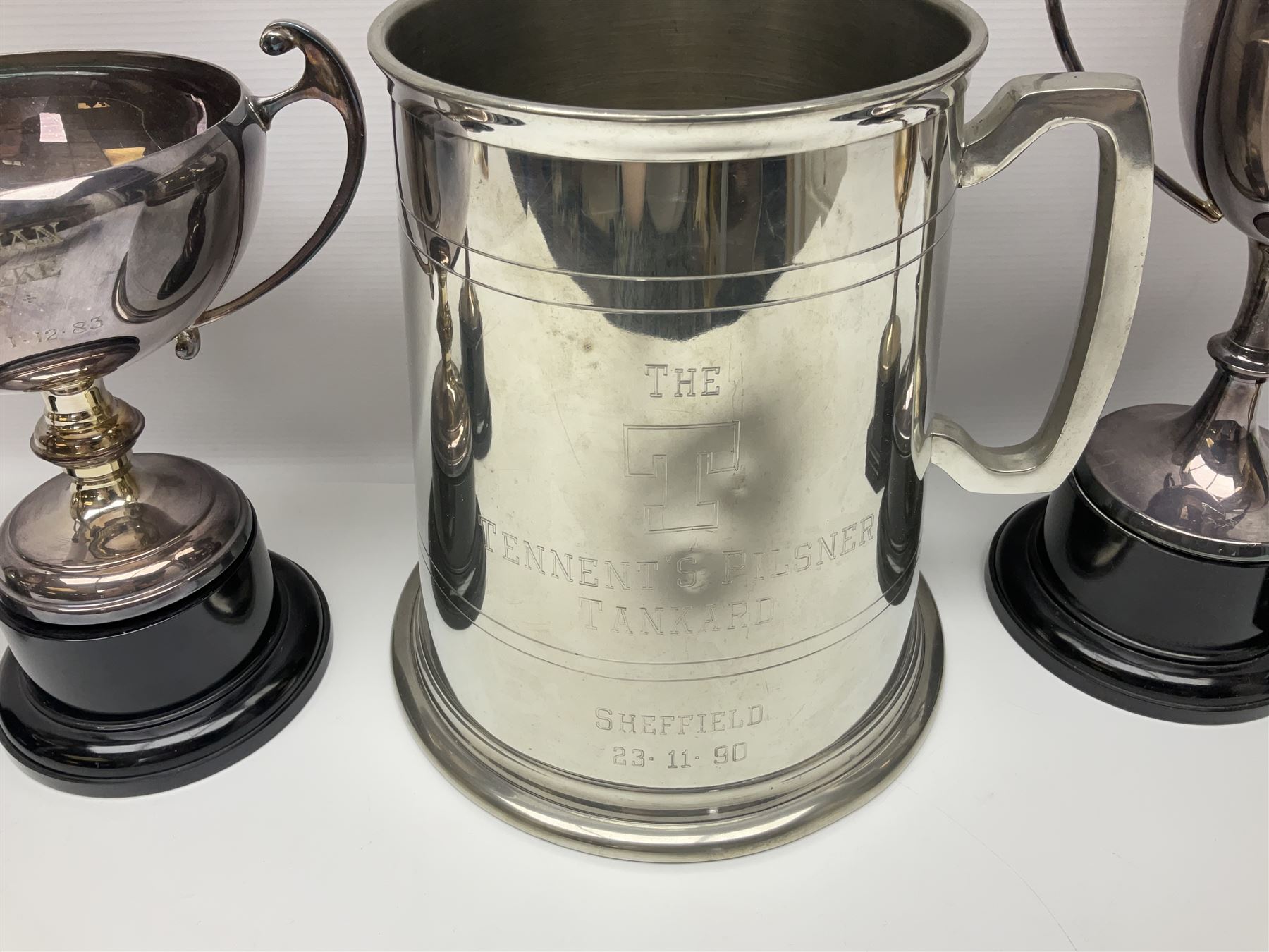 Collection of pewter and silver-plated trophy cups and presentation tankards, largest H28cm
