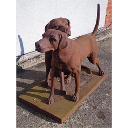  Pair cast iron dogs, one seated and one standing, H73cm W105cm  