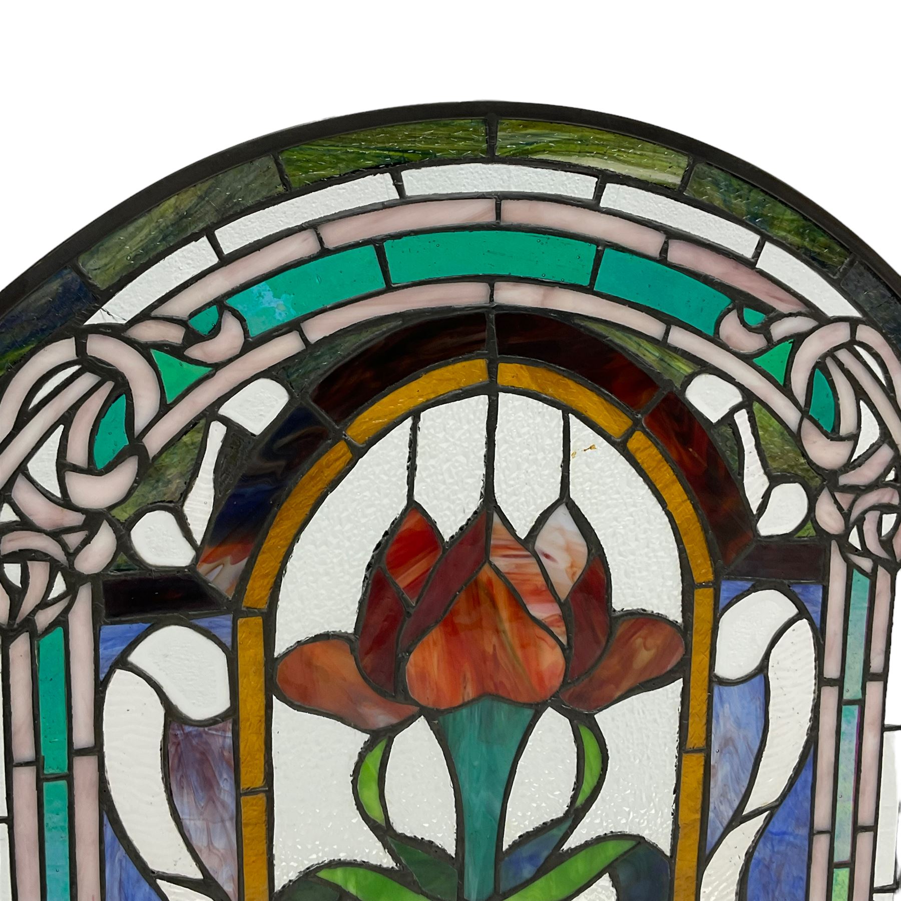 Art Nouveau design stained glass three panel fire screen, decorated with tulips and interlacing borders