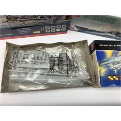 Ten plastic model kits of ships by Airfix, Revell, Dragon and Skywave, predominantly 1/600th scale including R.M.S. Titanic, HMS Invincible, two x HMS Ark Royal, HMS Fearless, HMS Hood, HMS Belfast, Bismarck etc; all boxed, most in factory sealed transparent packaging (10)