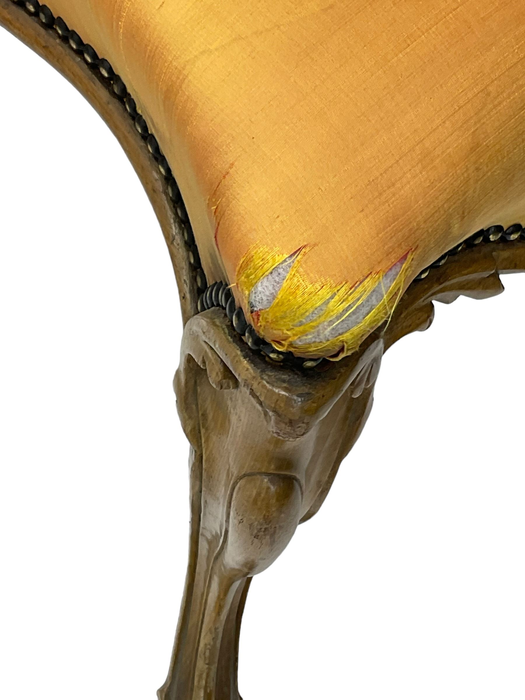 Pair of Victorian walnut side chairs, shaped cresting rail carved with acanthus leaves, overstuffed upholstered seats with stud band, on cabriole supports with scroll carved terminals