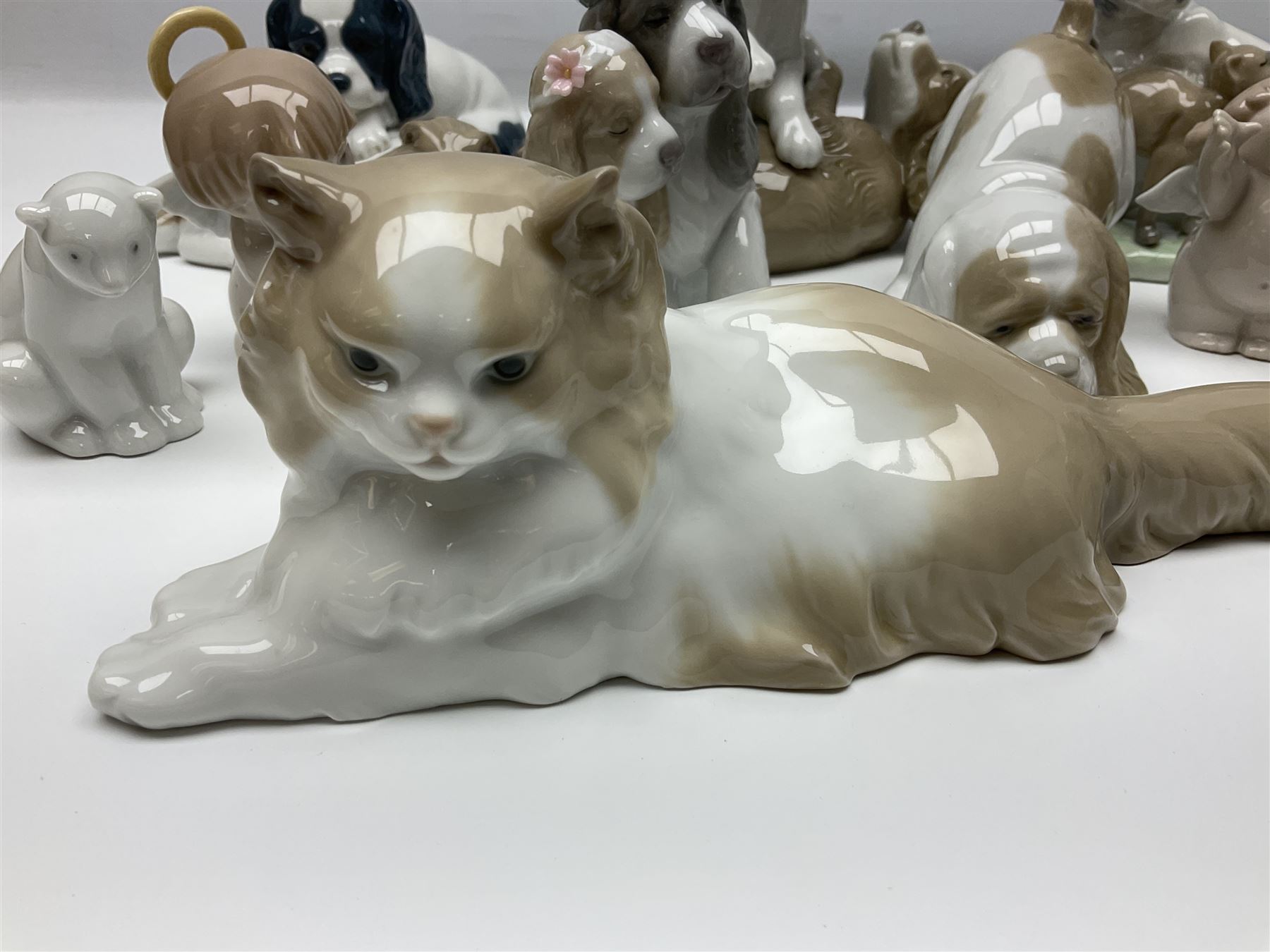 Ten Nao figures, to include three Cheeky Cherubs, Cat, Dog bride and groom etc