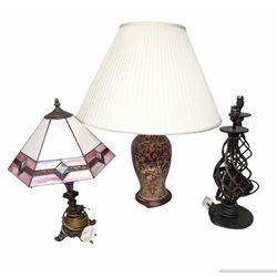Tiffany style table lamp, with pink shade and ornate metal base, together with a ceramic table lamp, with red, green and gold decoration and fabric shade and a pair of openwork twisted metal table lamps, tallest H72cm