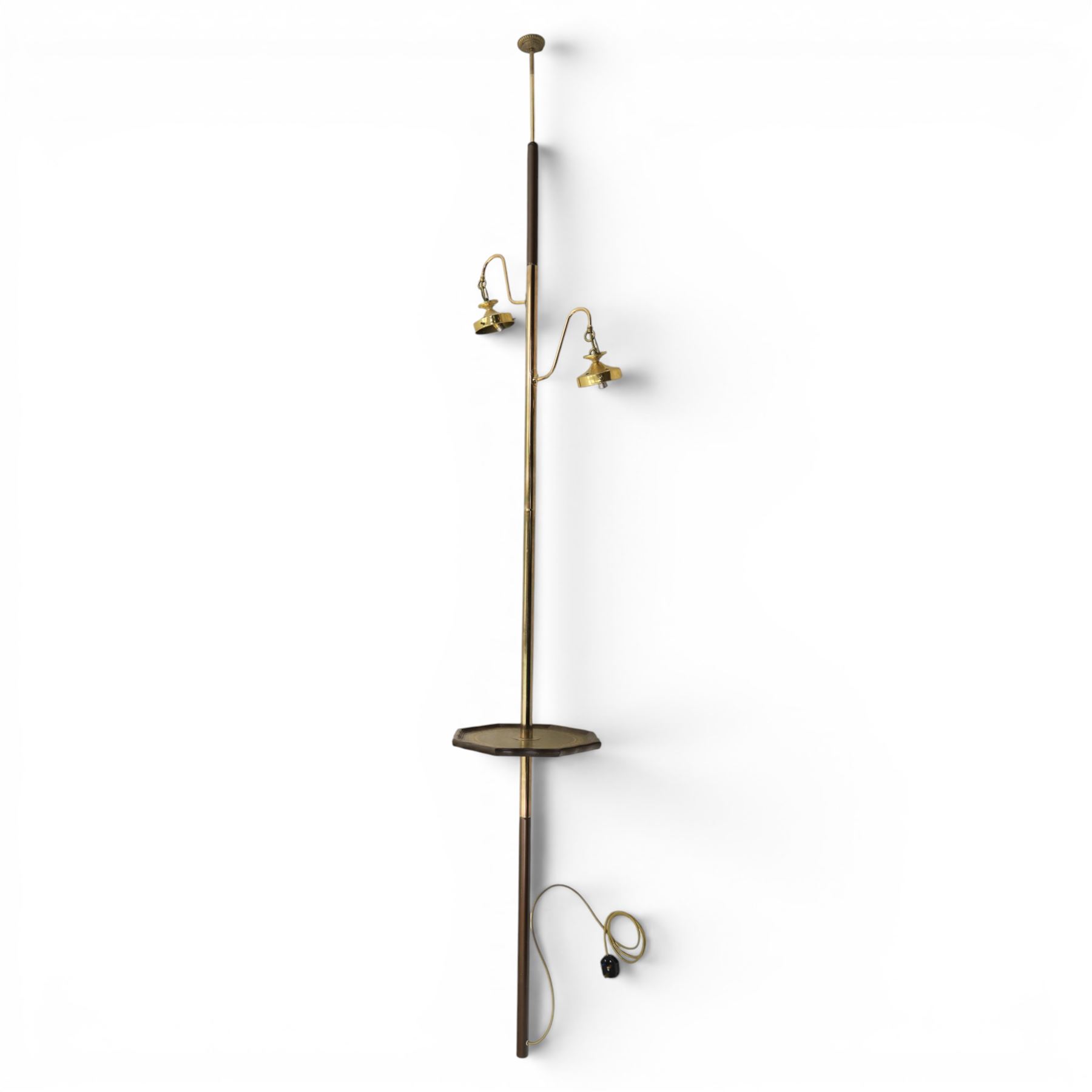 20th century floor to ceiling two branch standard lamp, with spring loaded ceiling mount, brass column, with octagonal moulded rim, green leather inset tooled 