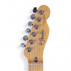 Fender Telecaster electric guitar, serial no. T021384 made in Japan c.1994, with Candy Apple Red body, white scratch plate and maple neck, guitar L98cm