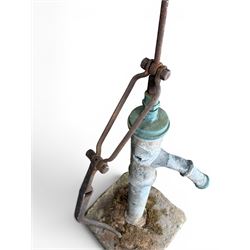 Georgian period lead garden water pump, with iron handle, set in square stone base