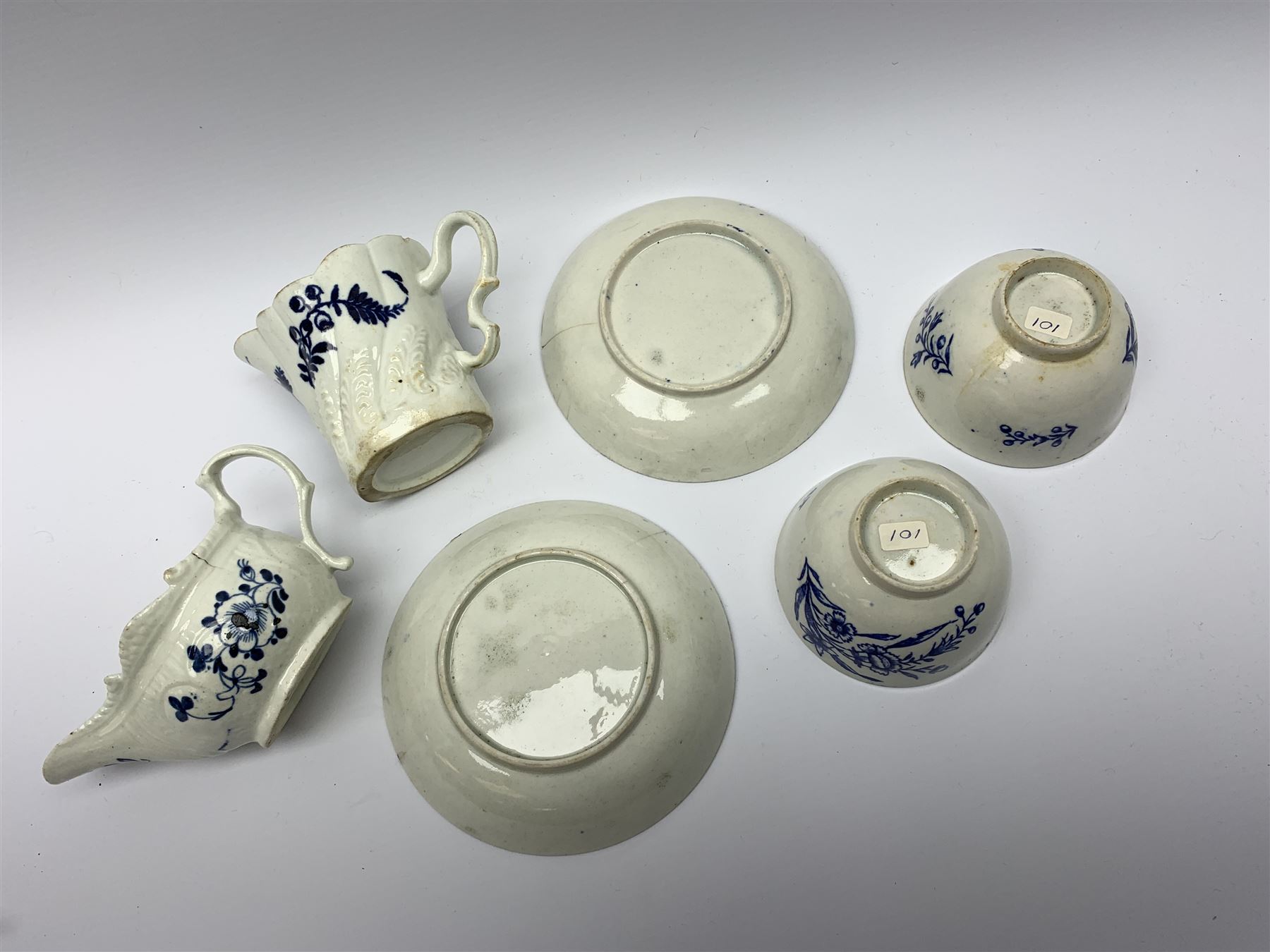 Late 18th century Liverpool Seth Pennington cream jug, H8.5cm, together with another late 18th century example, possibly also Liverpool Seth Pennington, and a pair of late 18th century Liverpool Seth Pennington tea bowls and saucers, saucer D12.5cm, tea bowl D8.5cm, (6)