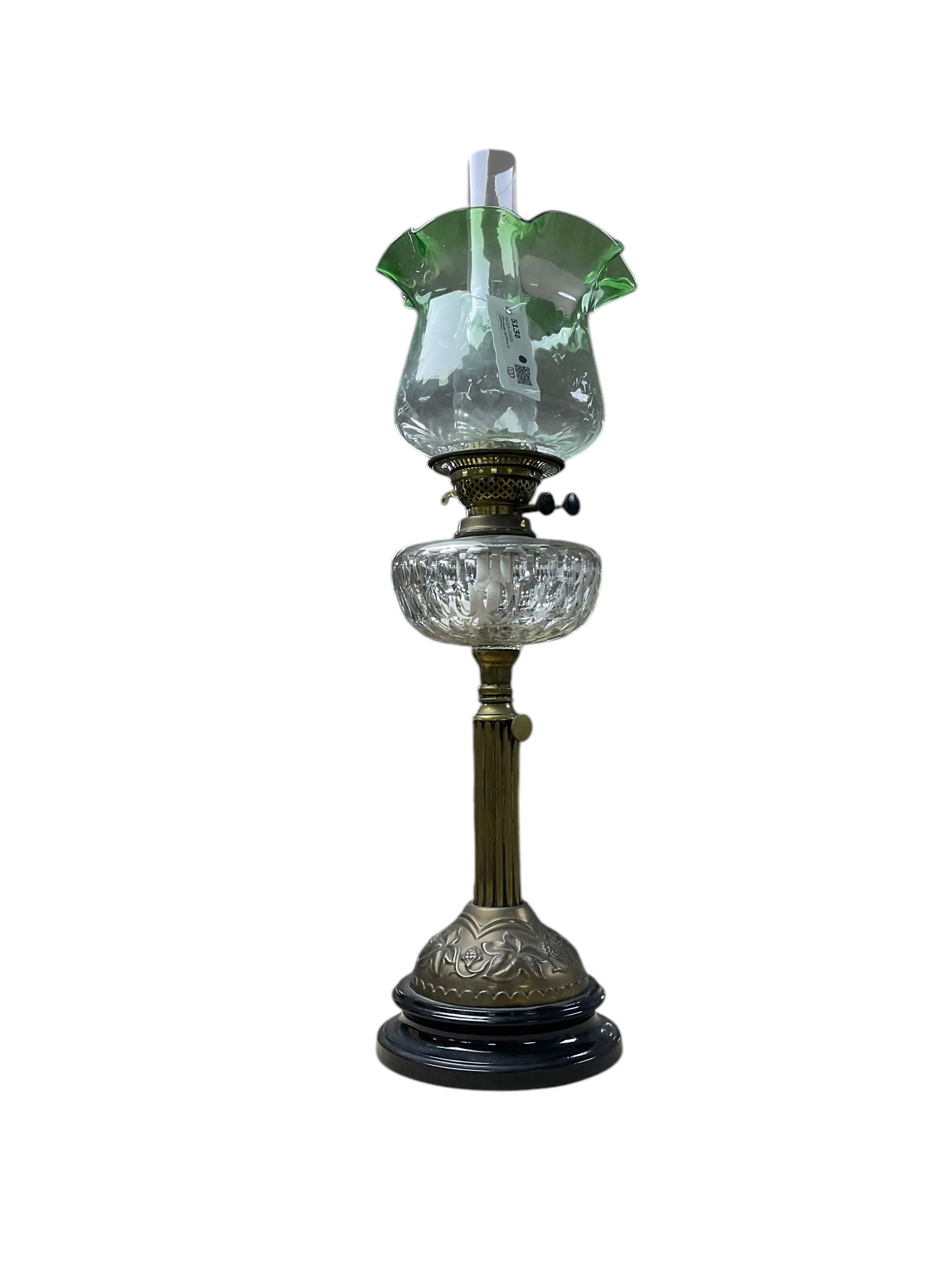 Oil lamp with frilled green glass shade, glass reservoir, upon upon corinthian column with stepped circular base, H74cm