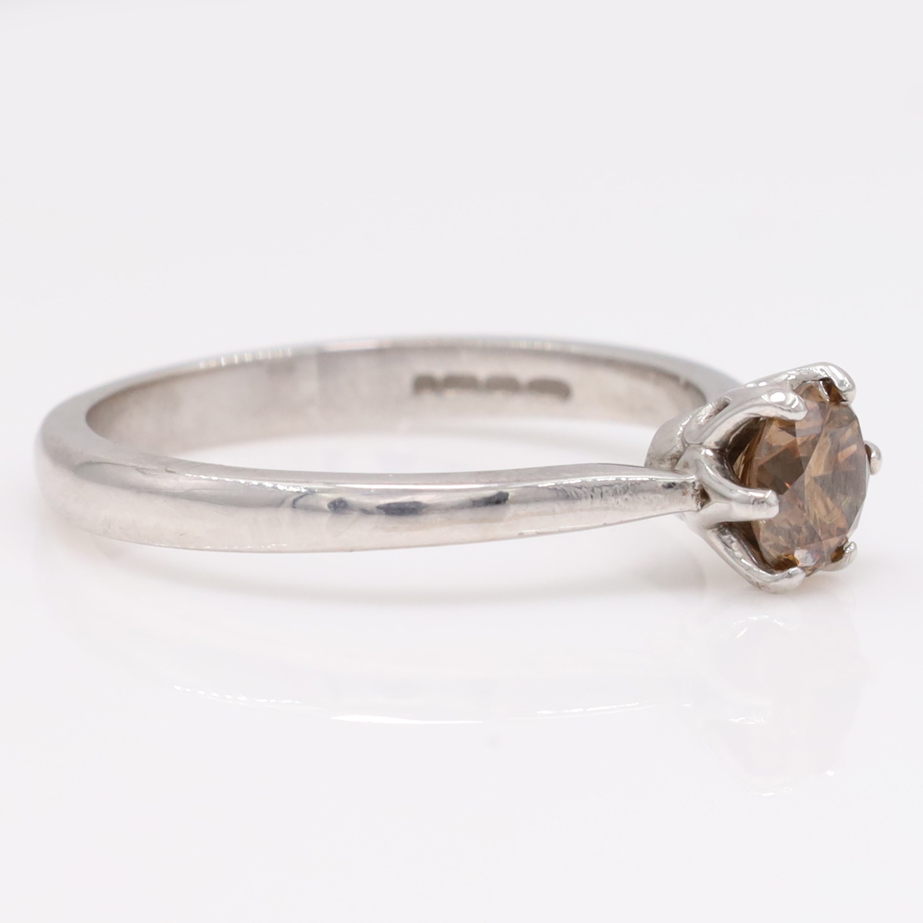 18ct white gold fancy brown diamond ring, six claw set with a round brilliant cut diamond of approx 0.80 carat, hallmarked