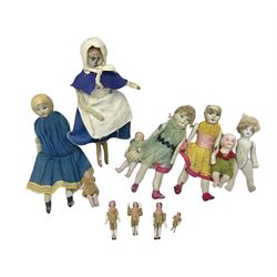 Twelve miniature bisque, bisque headed a
