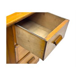 Leeway - late 19th century light oak child's roll-top desk, tambour top opening to reveal fitted interior with green felt writing surface and five pigeonholes, over three graduated drawers on the right side, raised on panelled side supports