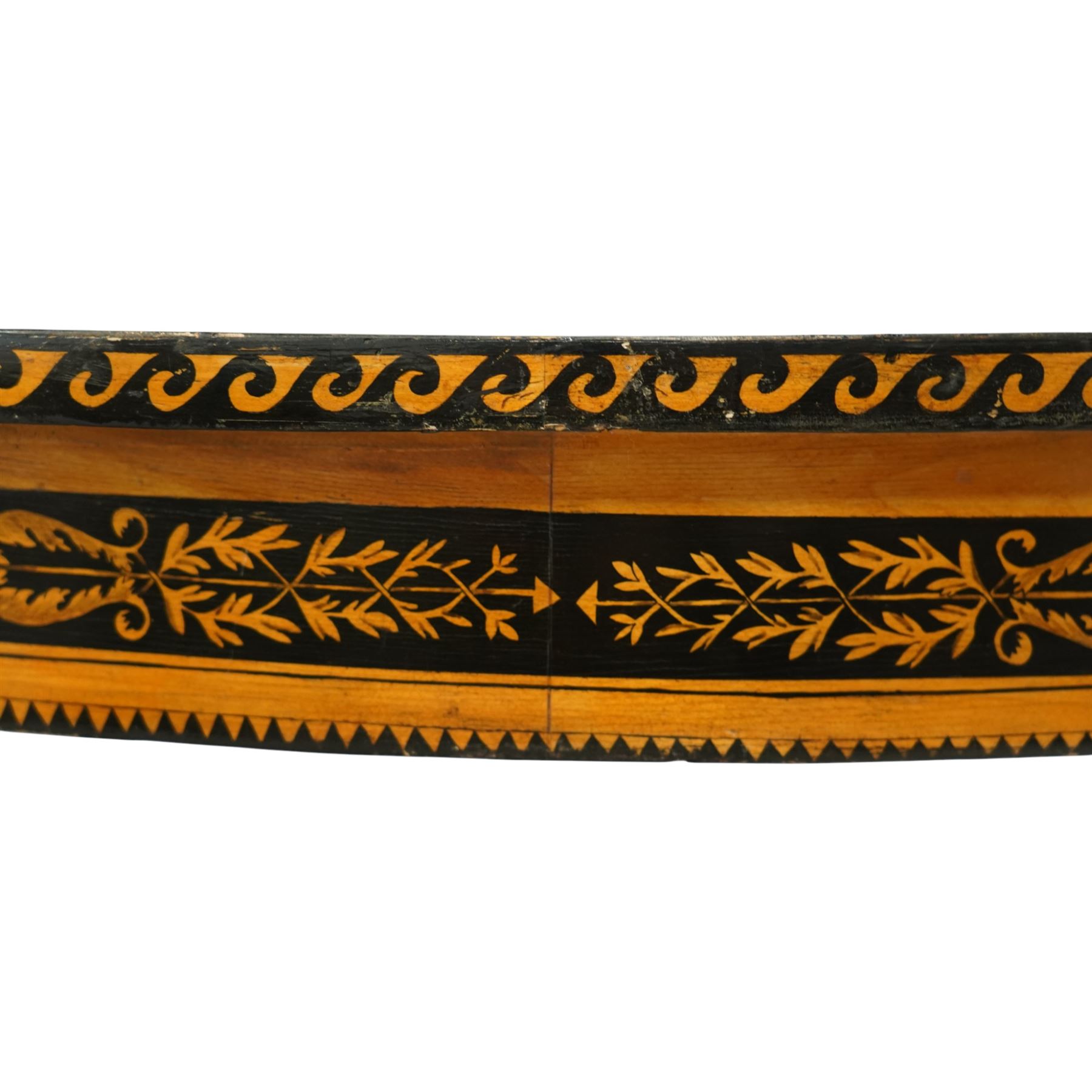 20th-Century Louis XVI-Style satinwood and penwork circular table or pair of console tables, the circular quarter-veneered top decorated in penwork with a central classical mask head motif within scrolling foliate and anthemion ornament on a contrasting black ground, above a conforming frieze decorated with Greek key-type scrolls. Raised on square tapering legs, each with an upper block panel decorated with compass-star motifs.