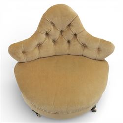 20th century pair of bedroom chairs upholstered in buttoned taupe velour, each of slipper chair form with low wraparound back and deep seat, the backs button tufted with padded wings, raised on turned front supports with castors