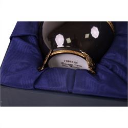 Limoges Fabergé  'Movie Camera' egg, the black and gilt hinged lid opening to reveal a gilt interior with a film camera to the center, with certificate and box, H14cm