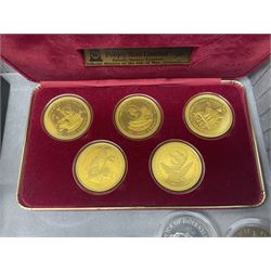 The Royal Mint United Kingdom 1977 silver proof two coin set, Queen Elizabeth II 2002 silver proof three coin set, comprising Bailiwick of Jersey, Bailiwick of Guernsey, and Alderney five pound coins, 'First Coinage of the British Virgin Islands' proof set, 1997 1/10 ounce fine silver Britannia, two King George V 1935 'Rocking Horse' crowns, various Isle of Man commemorative crowns, etc., house in a hard shell carry case