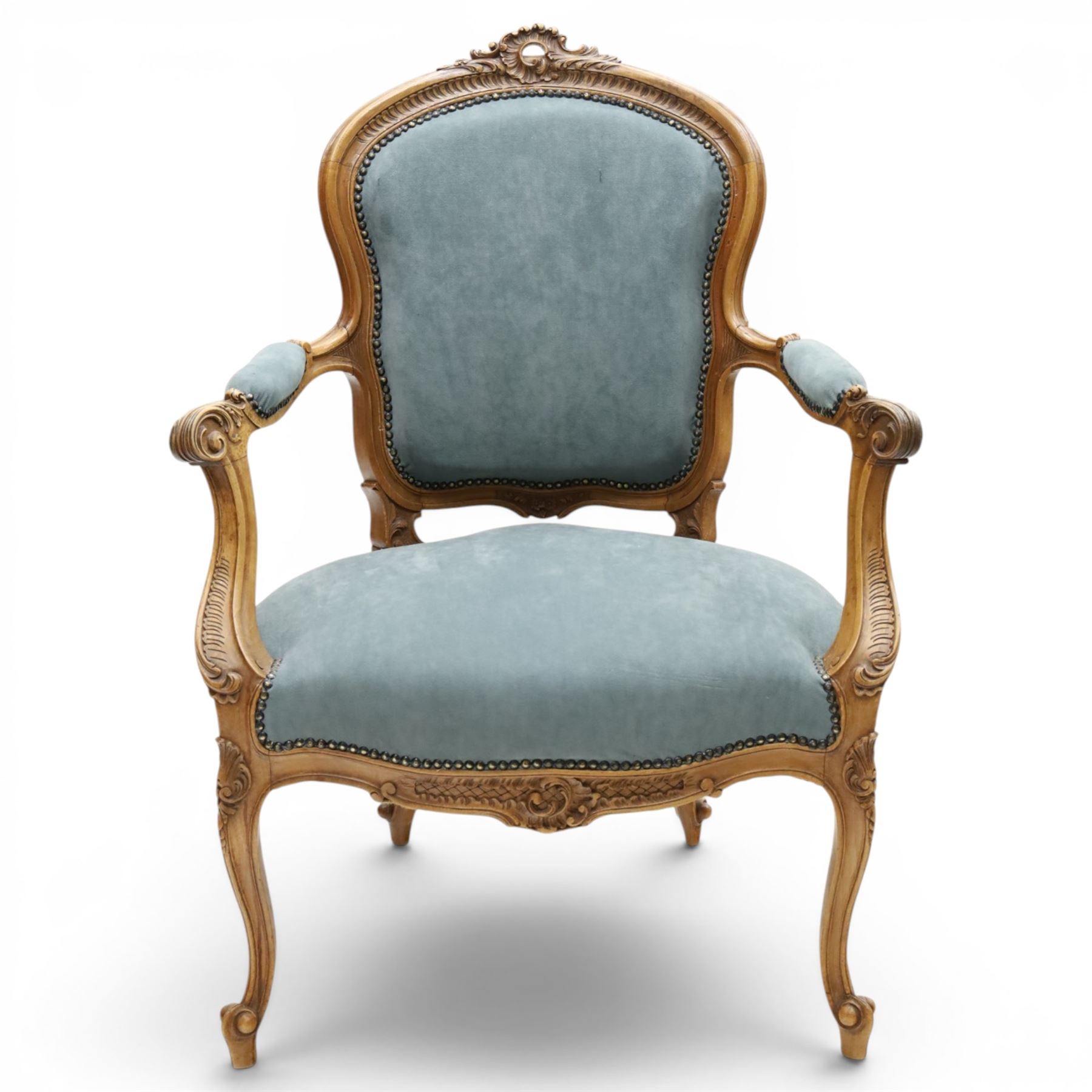 Louis XV design giltwood open armchair, shaped upholstered back with carved foliate cresting, padded scroll arms and serpentine seat upholstered in pale blue fabric with studwork, moulded and foliate carved frame, on cabriole supports with scroll feet