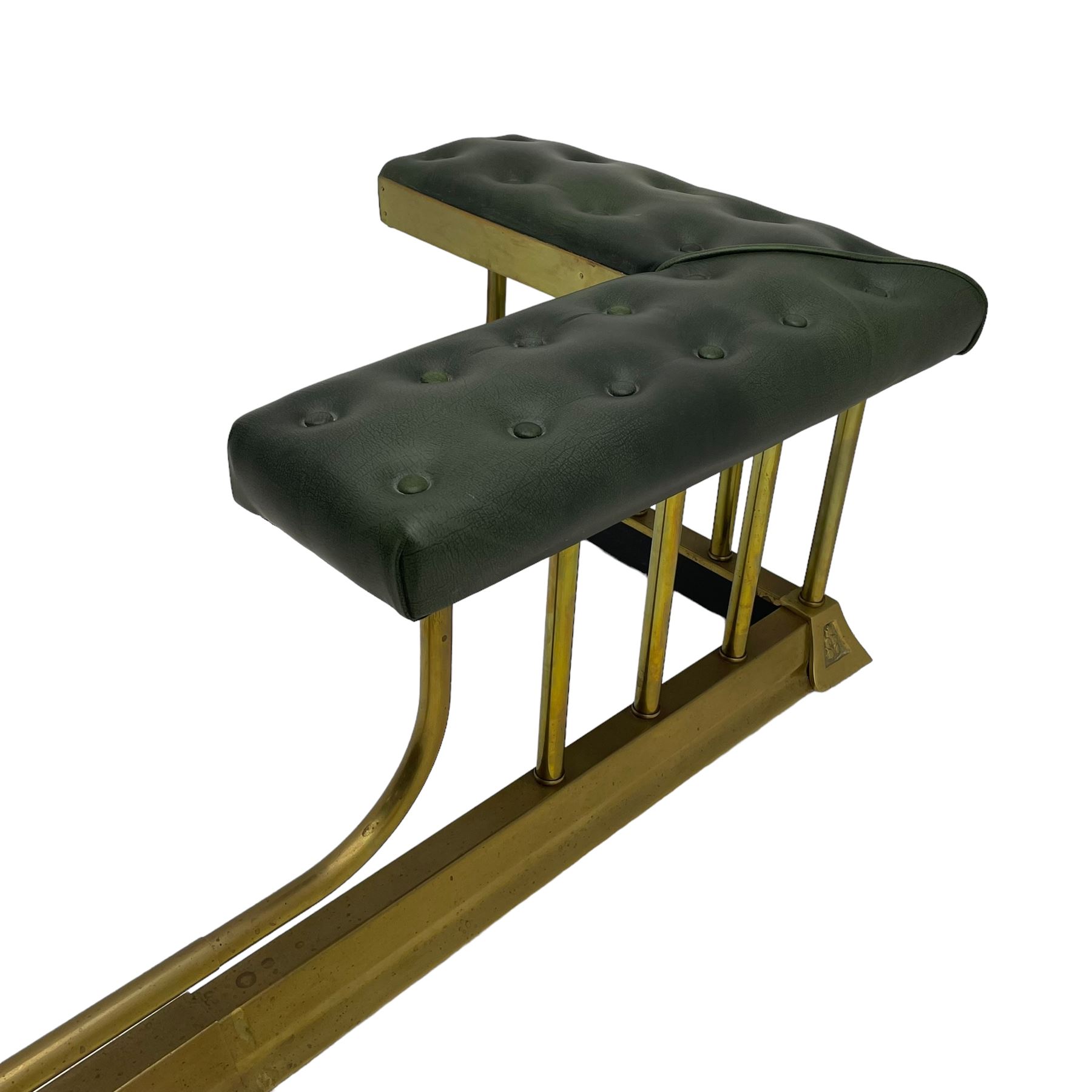 Victorian design brass telescopic extending club fire fender, the corner seats upholstered in buttoned green fabric over plain balustrade, on moulded base with floral cast corner brackets 