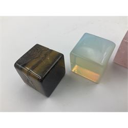 Ten cube mineral specimens, each cut and polished to highlight natural formations, including tiger eye, green aventurine, rose quartz, opalite, amethyst etc, H3cm 