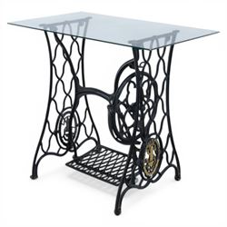 Sewing machine table with glass top, with Singer wrought metal base and foot pedal