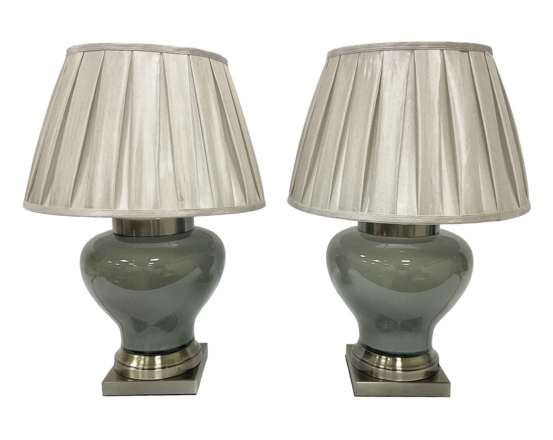 Pair of table lamps of squat baluster form, with a crackle glaze to a dark grey ground, upon a square base, including shade H57cm