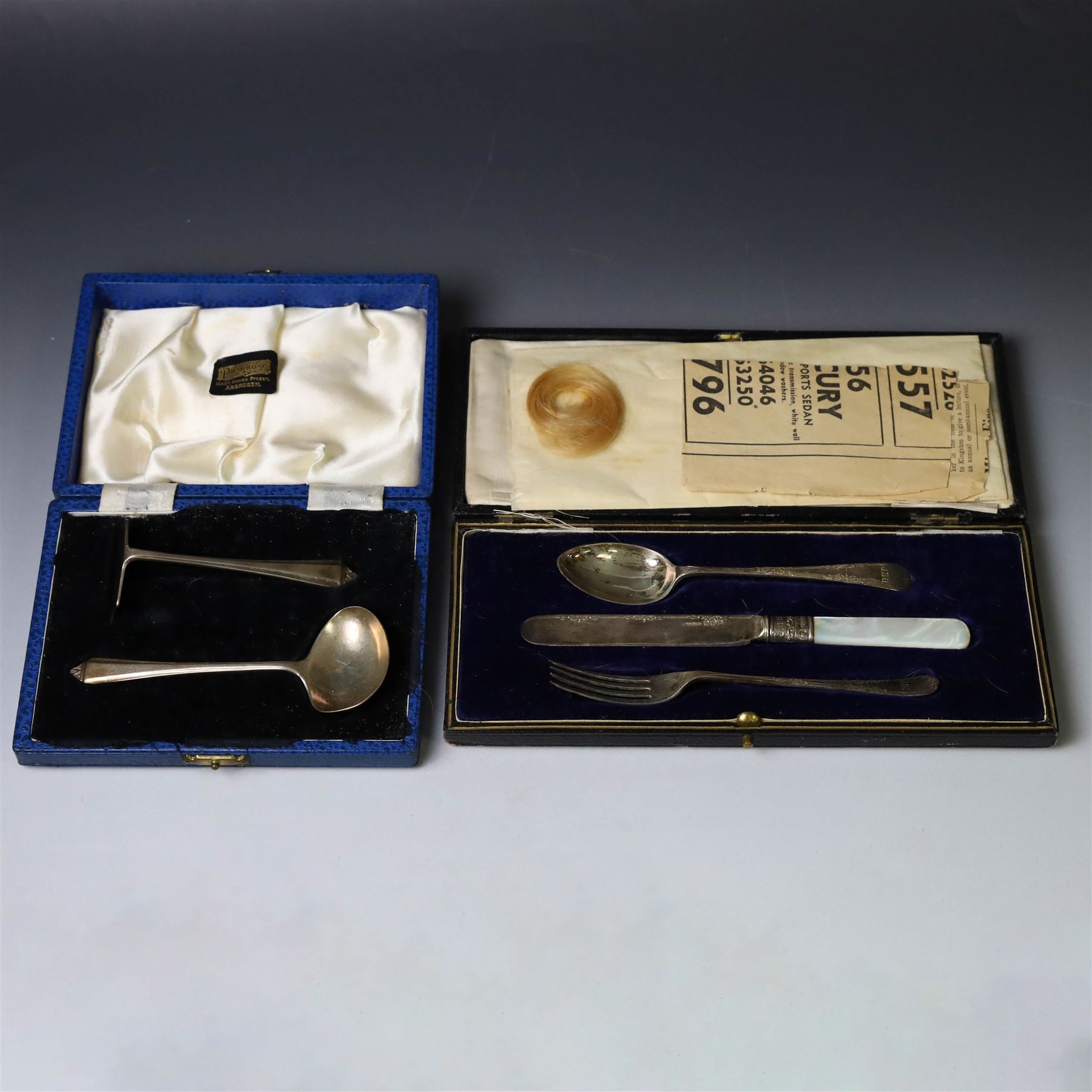 Silver Christening set, comprising spoon, fork and mother of pearl handled knife with engraved initials, together with a silver spoon and pusher set, all hallmarked, in fitted cases