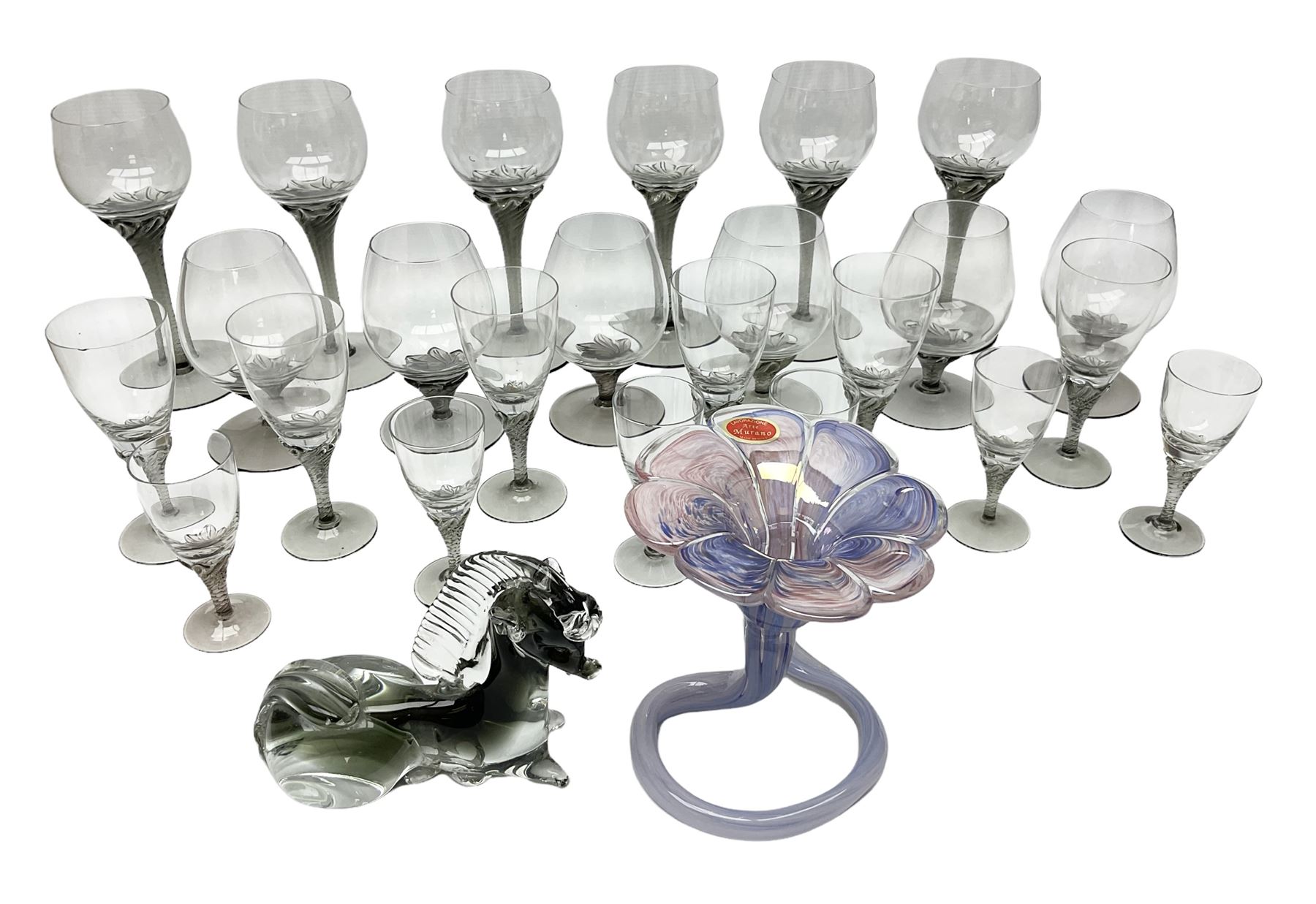 Murano glass figure of a recumbent horse, Murano Lavorazione purple and pink flower, and quantity of matching drinking glasses