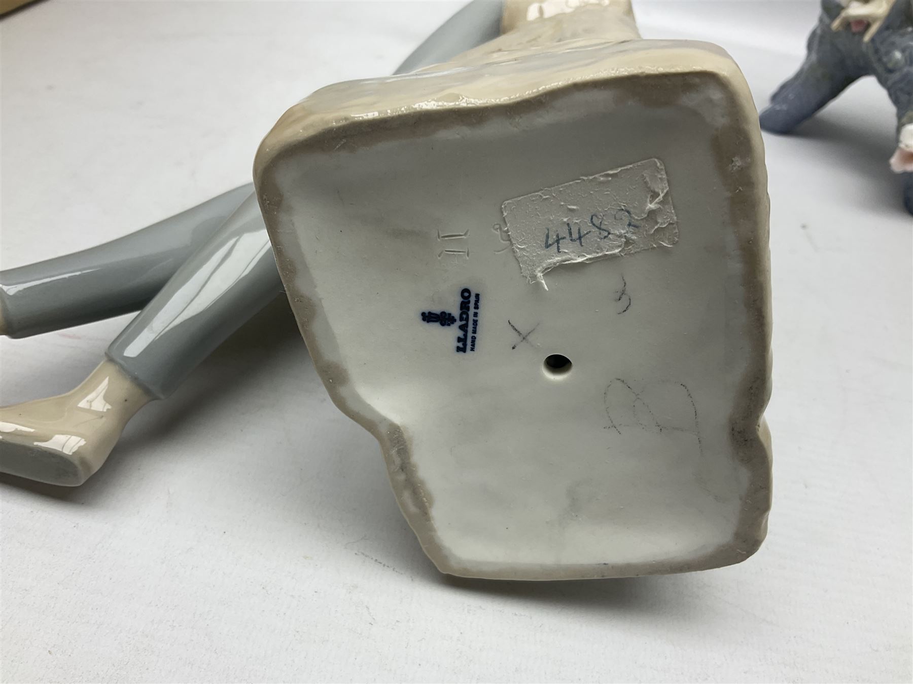 Four Lladro figures, comprising Touch of Class no 5377, Boy Student no 4517, Ocean Beauty no 5785 and Carnival Couple no 4882, largest example H45cm