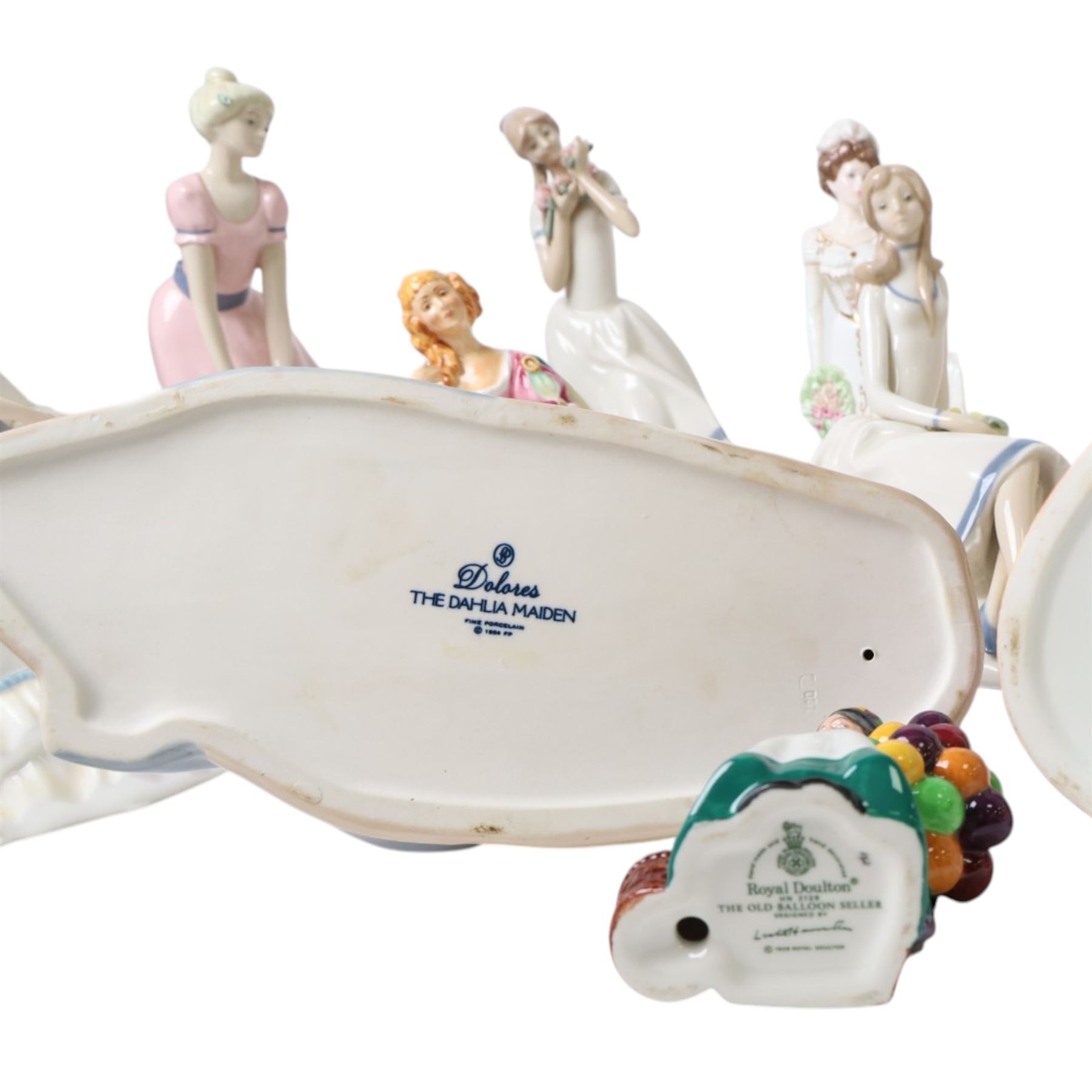 Collection of Royal Doulton figures, including miniatures The Balloon Seller HN2130, The Old  Balloon Seller HN2129, Good King Wenceslas etc, together with a Coalport figure and others 