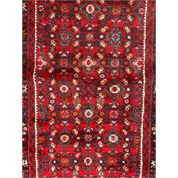 North West Persian Malayer runner, red ground field decorated with Herati motifs, guarded border decorated with trailing flowerhead band 