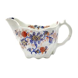 18th century Lowestoft cream jug, circa 1775, the moulded body decorated with floral sprays and sprigs in blue and iron red and heightened with gilt, H5.5cm