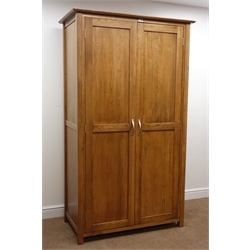  Modern oak double wardrobe, moulded top, two doors enclosing hanging rail, stile supports, W110cm, H191cm, D59cm  